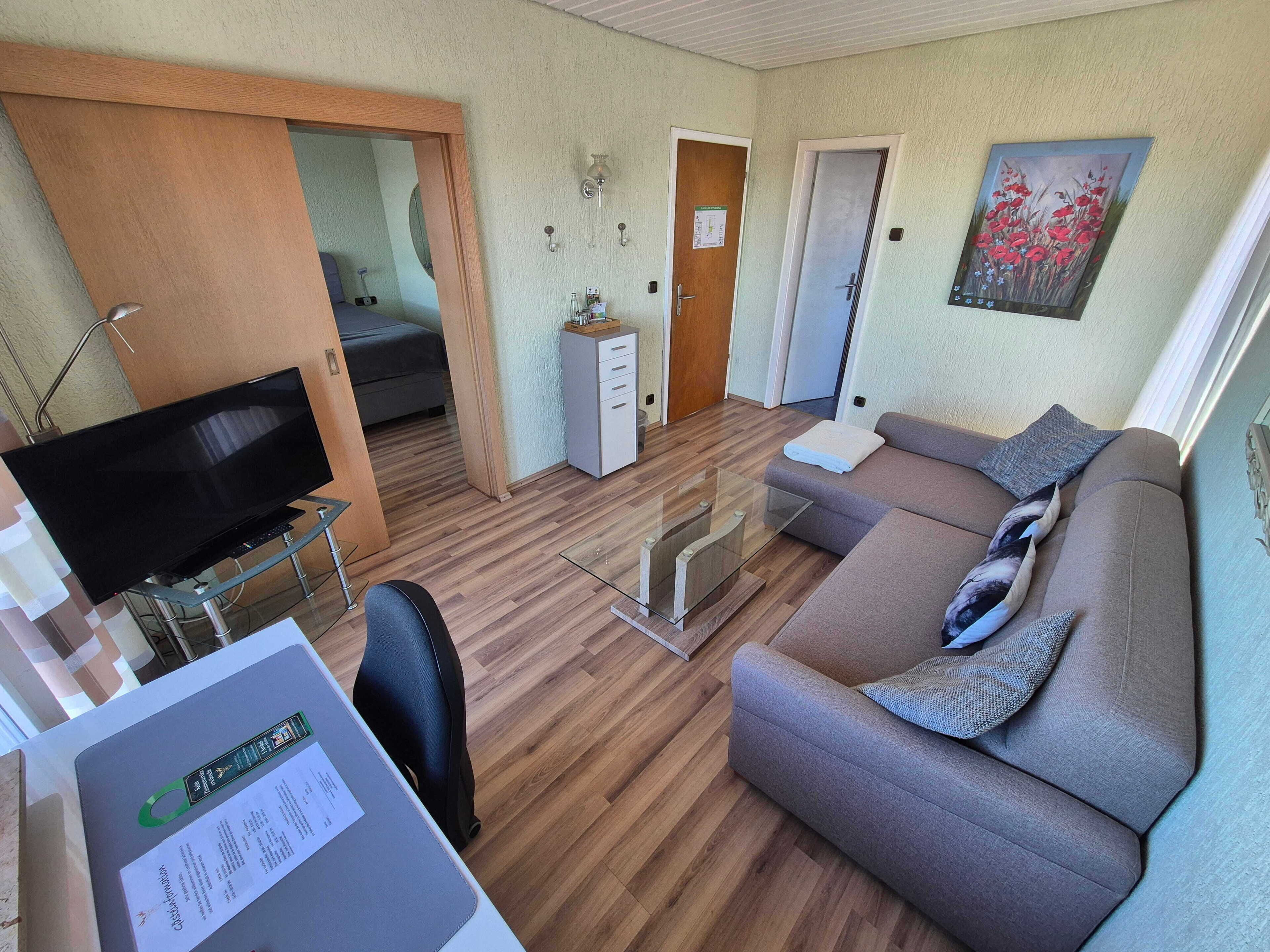 Comfort-Dreibettzimmer, Balkon | Wohnbereich
