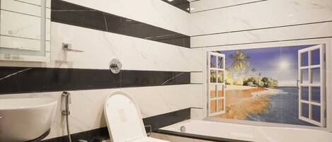 A bathroom with a toilet, sink, and a window with a beach mural.