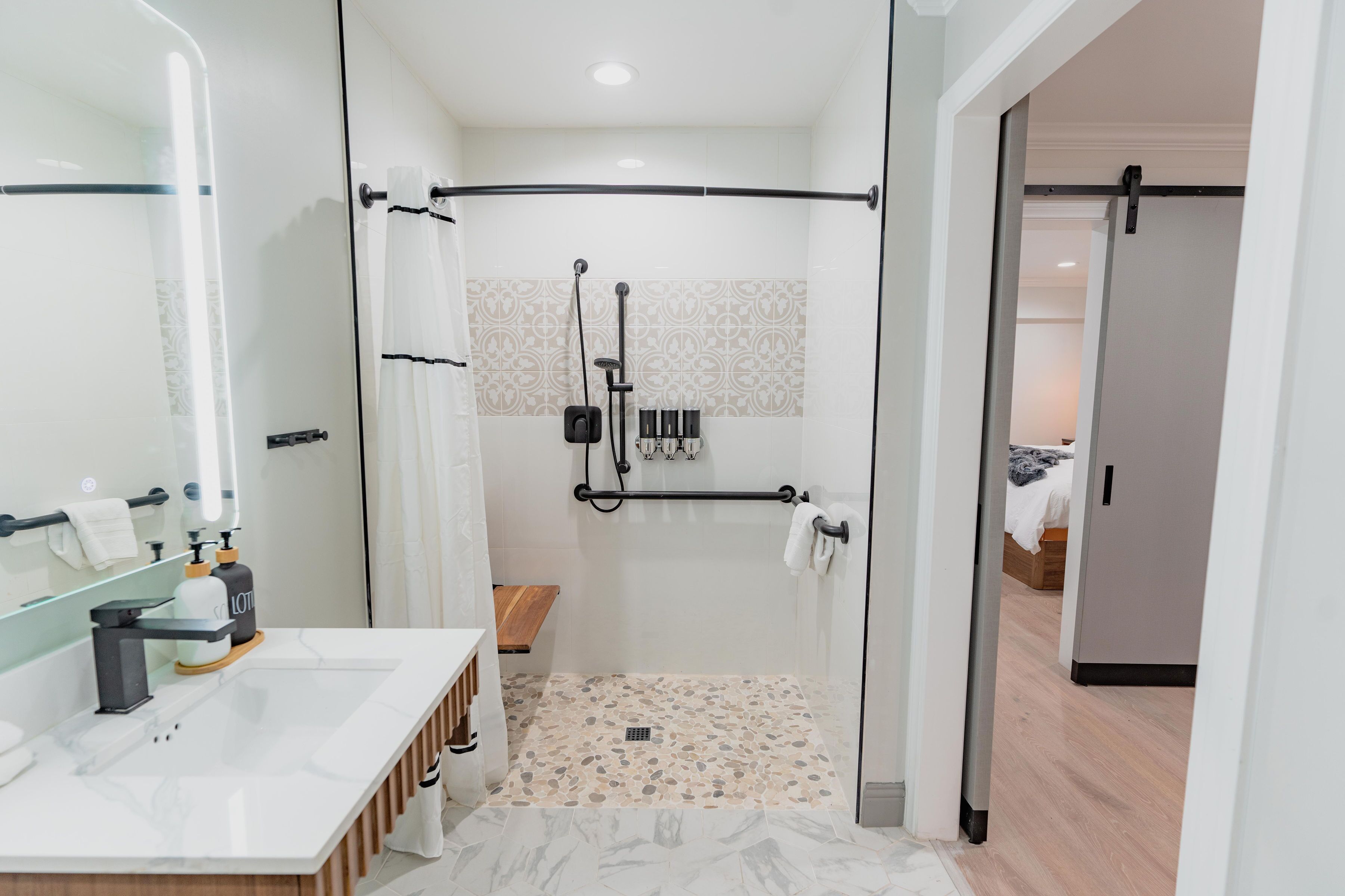 Comfort ADA Suite - 112 | Bathroom | Hair dryer, towels, soap, shampoo