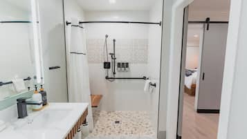 Comfort ADA Suite - 112 | Bathroom | Hair dryer, towels, soap, shampoo