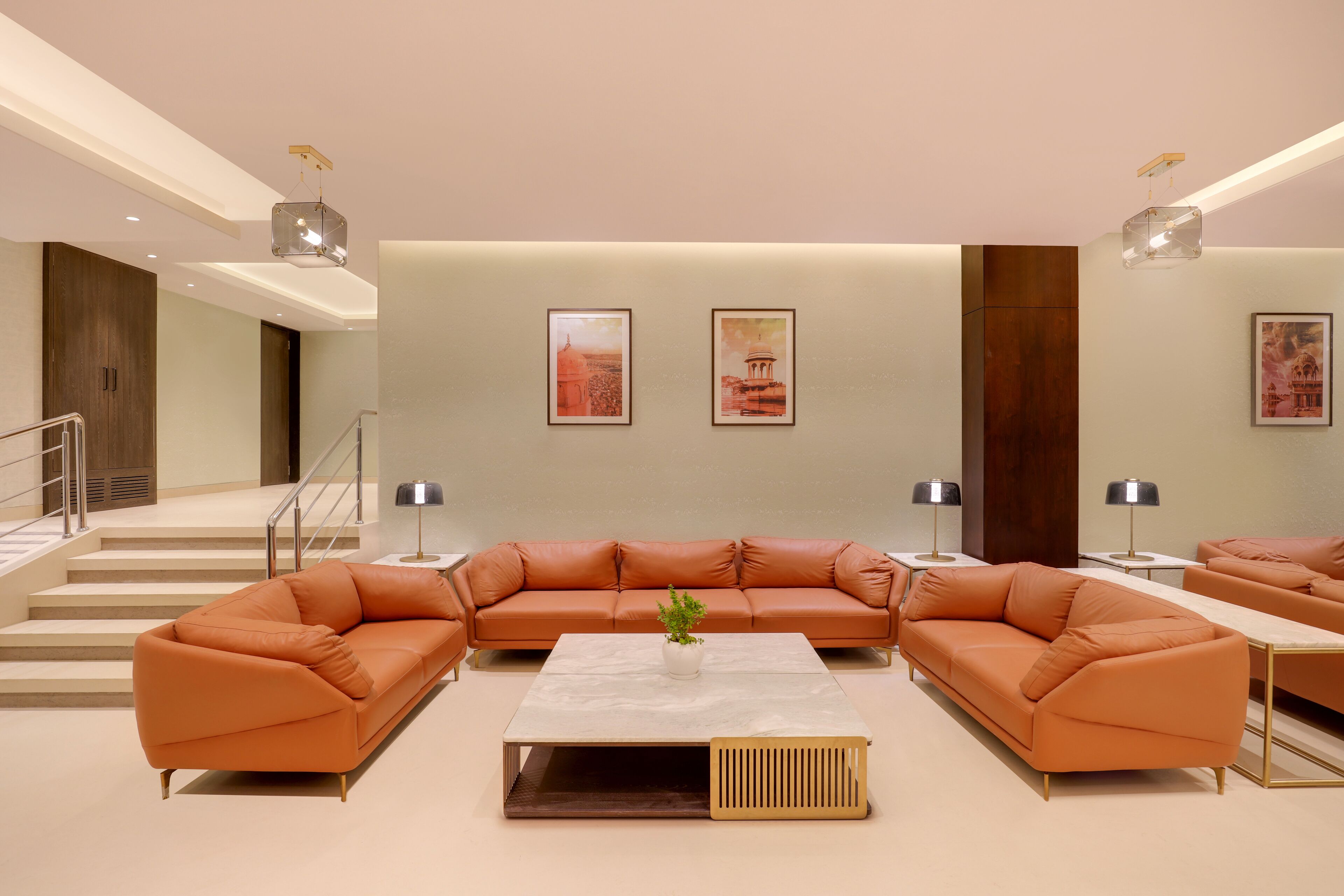 A modern living room with a sectional sofa, a coffee table, and two side tables.