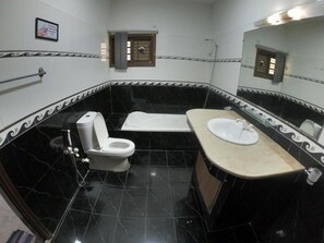 Deluxe Double Room | Bathroom | Shower, designer toiletries, bathrobes, slippers