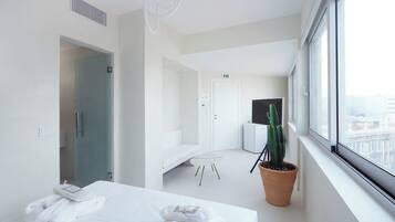 Suite with City View 6 | Living area | 43-inch Smart TV with cable channels, computer monitors