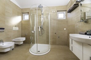 Bidet, towels, soap, toilet paper