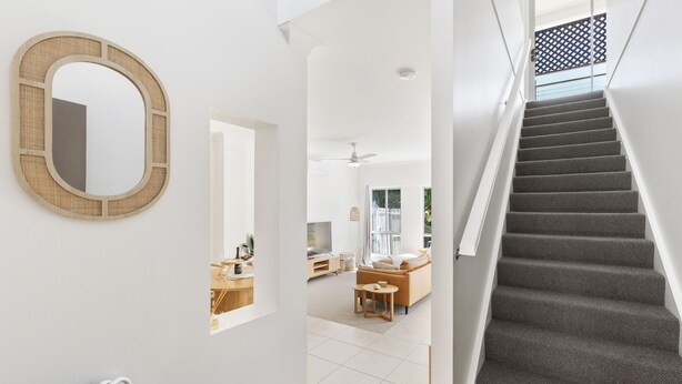 A staircase with carpeted steps leading to a landing. - 600m to esplanade - Spacious + Everything you need (Pialba)
