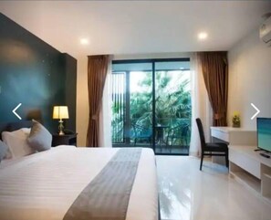 Estudio Deluxe, 1 cama de matrimonio, balcón, vistas al jardín | 1 dormitorio, escritorio, cortinas opacas y sistema de insonorización