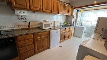 Apartment | Private kitchen | Full-size fridge, microwave, oven, stovetop