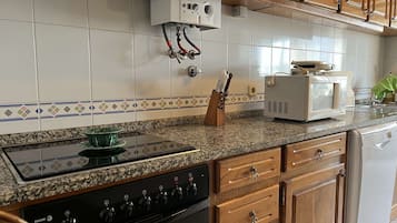 Apartment | Private kitchen | Full-size fridge, microwave, oven, stovetop