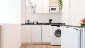 Microwave, coffee/tea maker, toaster, cookware/dishes/utensils