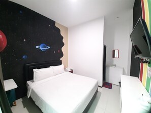 Relax in a stylish room with a large bed, wall-mounted TV, and a unique space-themed mural.