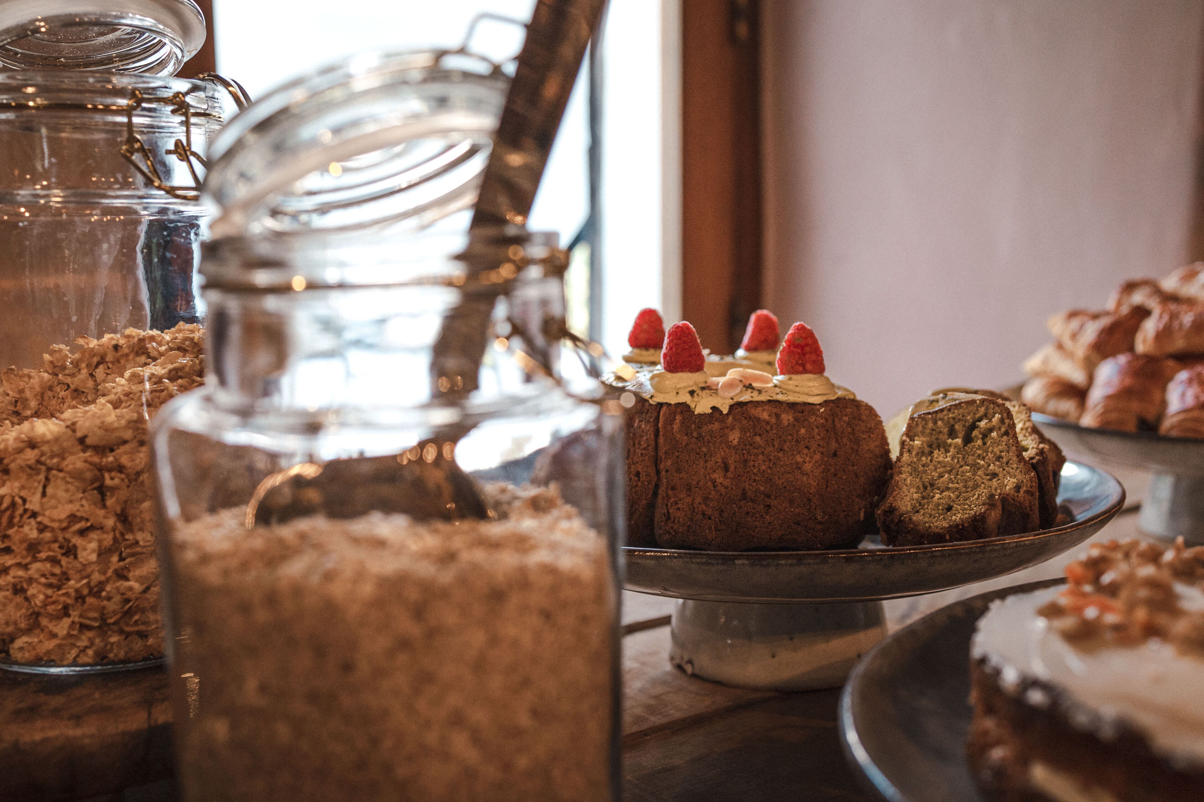 A bakery display with cakes and pastries.