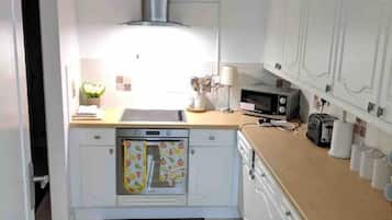 Fridge, microwave, coffee/tea maker, cookware/dishes/utensils