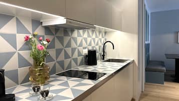 Mini-fridge, microwave, stovetop, cookware/dishes/utensils