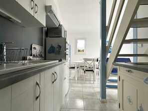 Fridge, microwave, stovetop, coffee/tea maker