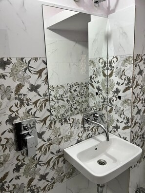 Shower, bidet, towels, soap