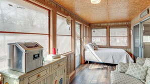 A cozy room with a bed, a small kitchenette, and a window with a view. - Pet-friendly Higden Getaway < 1 Mi to Marina! (Higden)