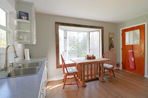 Fridge, stovetop, dishwasher, coffee/tea maker