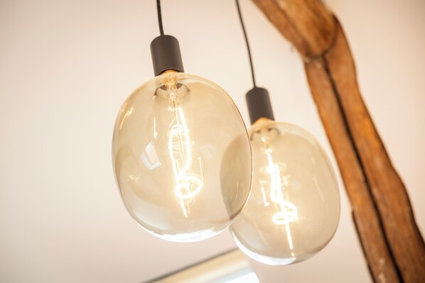 Two spherical pendant lights with visible filament bulbs.