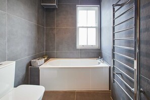 Shower, hair dryer, towels, shampoo