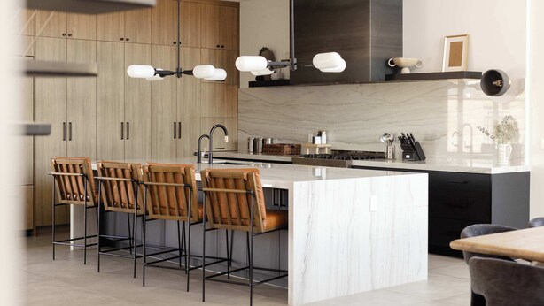 A modern kitchen with a large island, bar stools, and a built-in stove. - Scottsdale Retreat - Pool, Outdoor Grill, Firepit (Scottsdale)