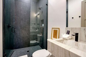 Shower, hair dryer, towels, soap