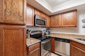 Fridge, microwave, oven, stovetop - Charming first floor  with mountain views  across from community amenities (Tucson)