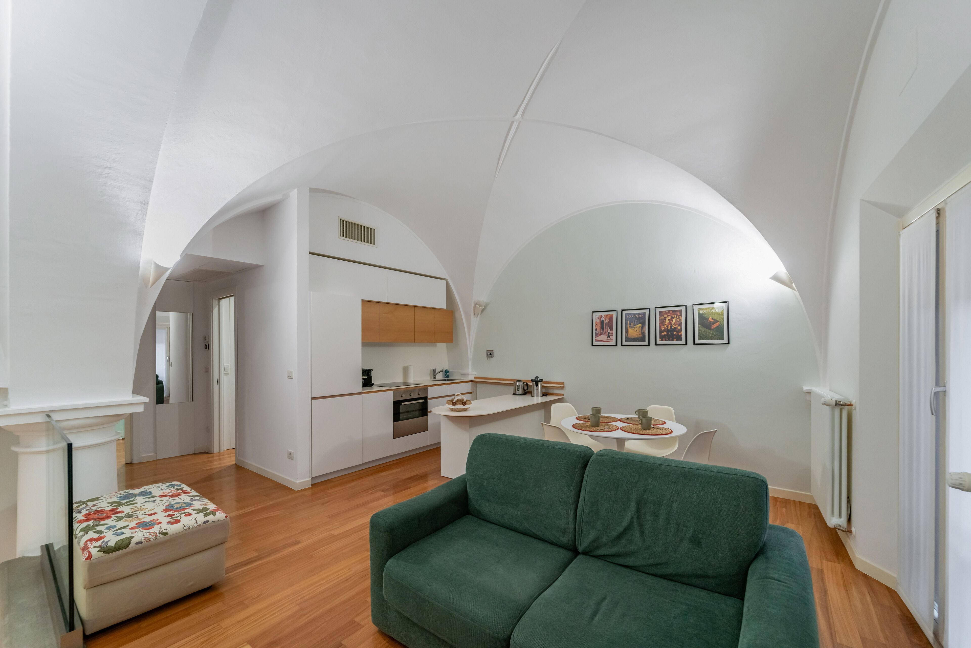 A modern apartment with a kitchen, dining area, and living room.