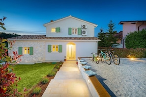 A two-story house with a stone facade, a tiled roof, and a gravel driveway. - Villa Bartol with private pool, table tennis, darts (Trviz)