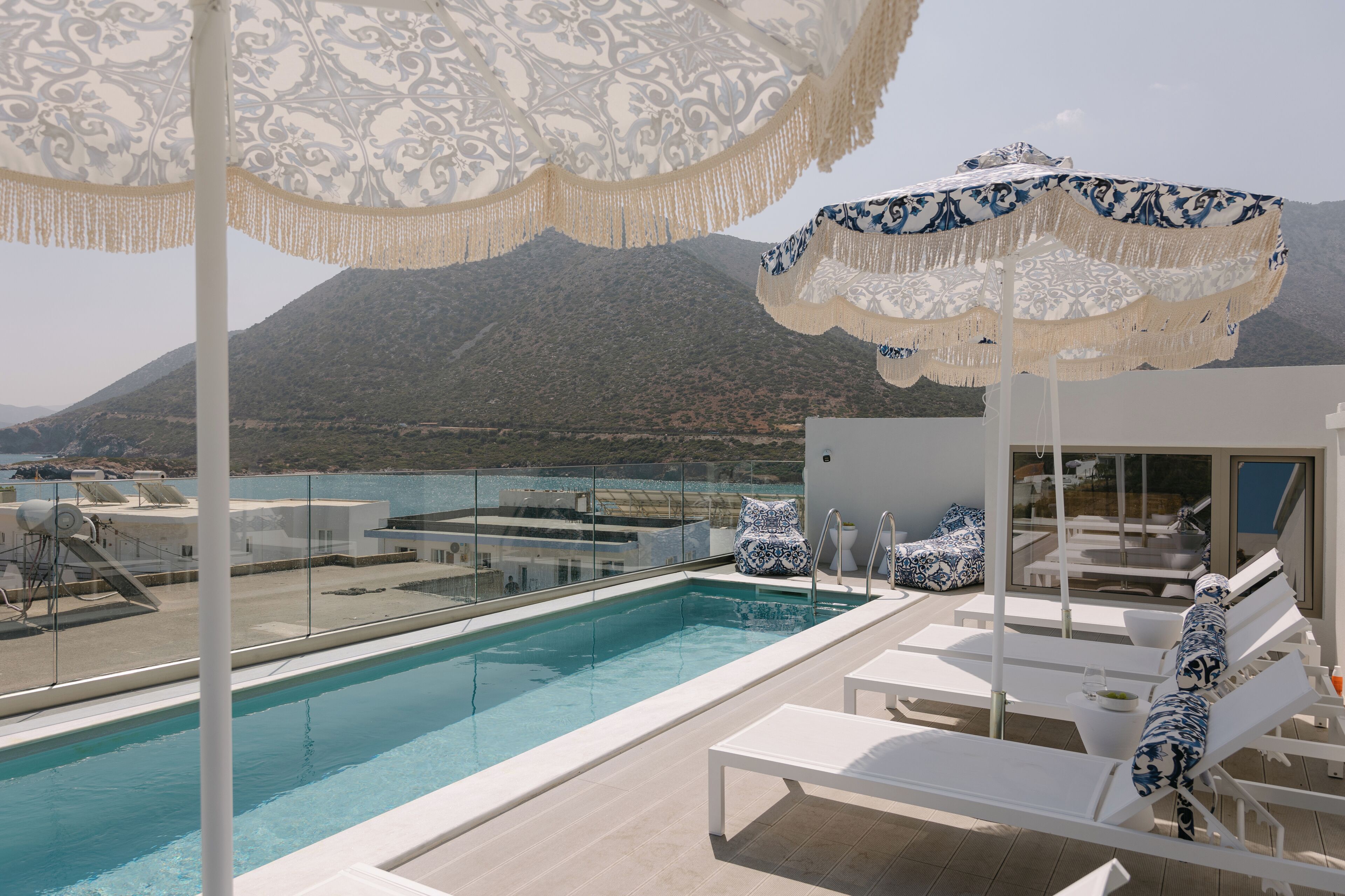 Seasonal outdoor pool, pool umbrellas, pool loungers