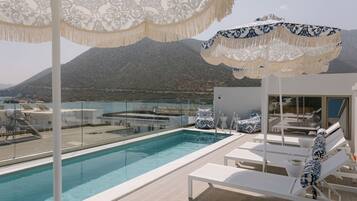 Seasonal outdoor pool, pool umbrellas, pool loungers