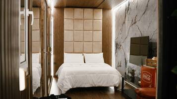 Chambre Deluxe | 1 chambre, coffres-forts dans les chambres, Wi-Fi gratuit