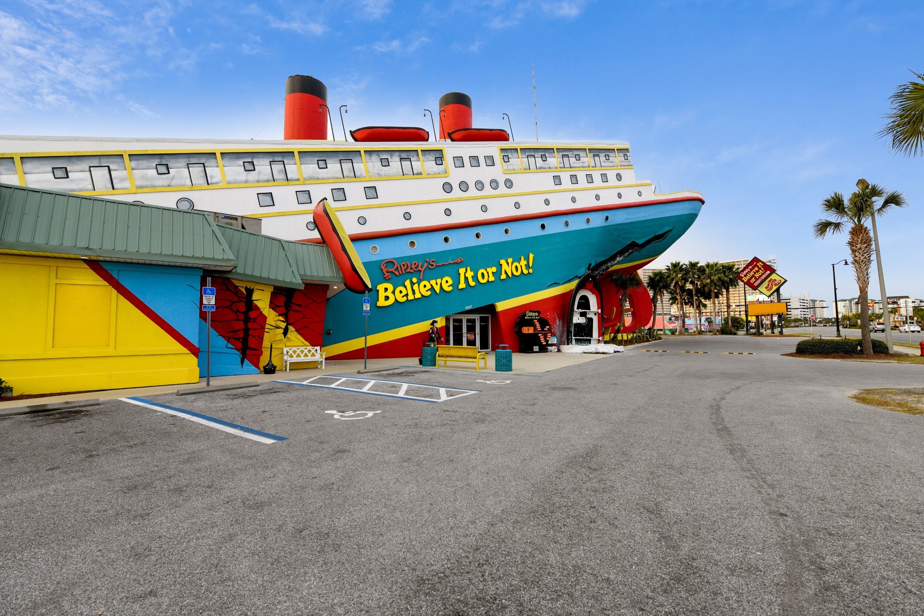 A colorful cruise ship-themed building with a sign that reads "Believe It or Not!".