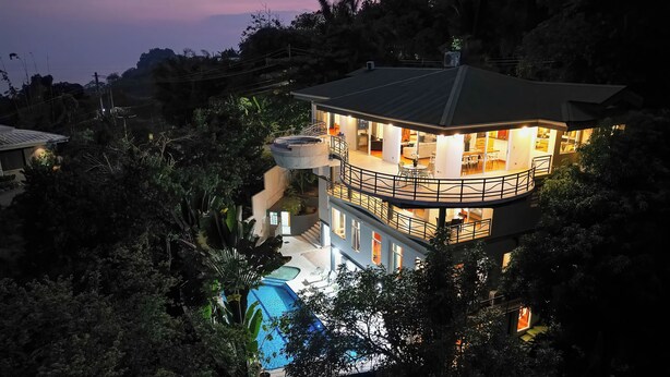 A multi-story house with a pool, surrounded by dense vegetation. - Casa Diamante - Top Rated Vacation Home in Manuel Antonio! (Quepos)