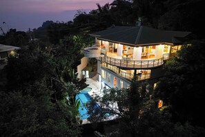 A multi-story house with a pool, surrounded by dense vegetation. - Casa Diamante - Top Rated Vacation Home in Manuel Antonio! (Quepos)