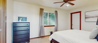Dog-friendly home with water views, deck, grill, wood stove, & private W/D