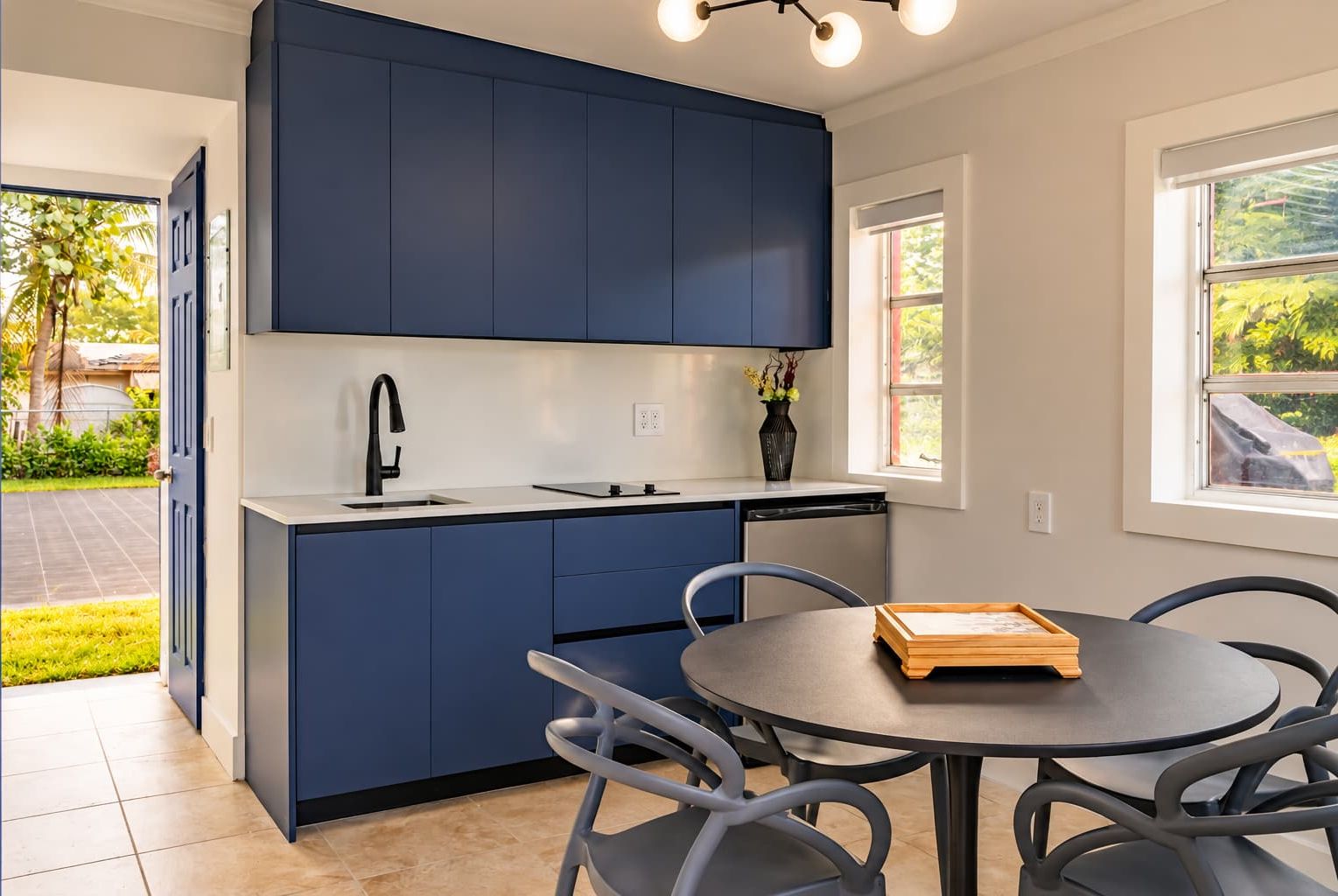 A kitchenette located in the detached backyard suite alongside Bedroom 8.