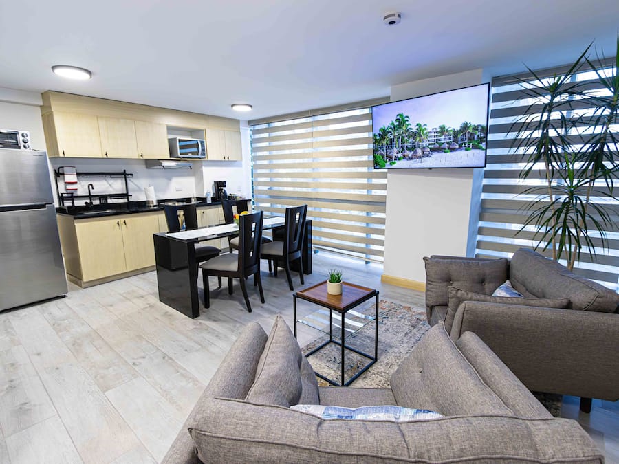 Comfort Apartment, 2 Bedrooms, Kitchen | Living area | 55-inch Smart TV with cable channels