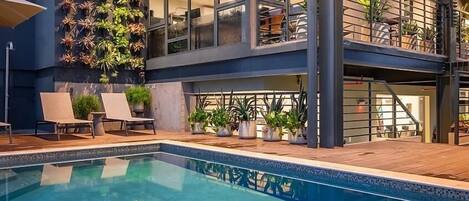 Outdoor pool, open 8:00 AM to 10:00 PM, pool umbrellas, pool loungers