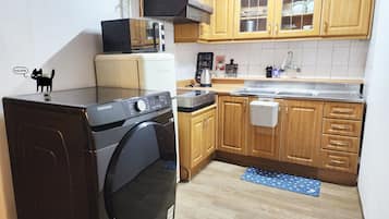 Fridge, microwave, cookware/dishes/utensils
