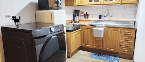 Fridge, microwave, cookware/dishes/utensils