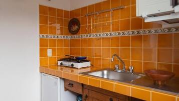 Fridge, microwave, cookware/dishes/utensils