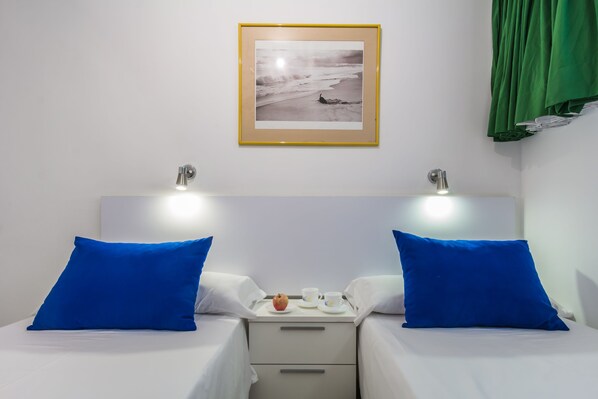 A hotel room with two beds, a nightstand with a tray of breakfast items, and a framed picture on the wall. - Alsol Don Palomón (San Bartolomé de Tirajana)
