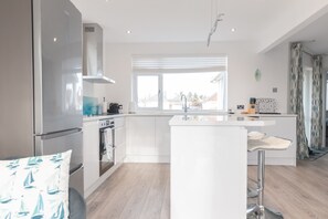 Fridge, microwave, oven, dishwasher - Ocean La Vie - recently renovated bungalow in Barton on Sea. (Barton on Sea)