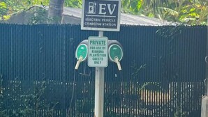 An electric vehicle charging station sign with a private use notice for Kiahnua Plantation guests only.