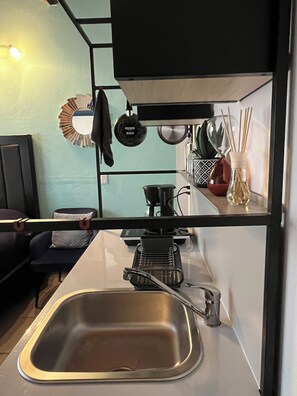 Fridge, microwave, stovetop, coffee/tea maker