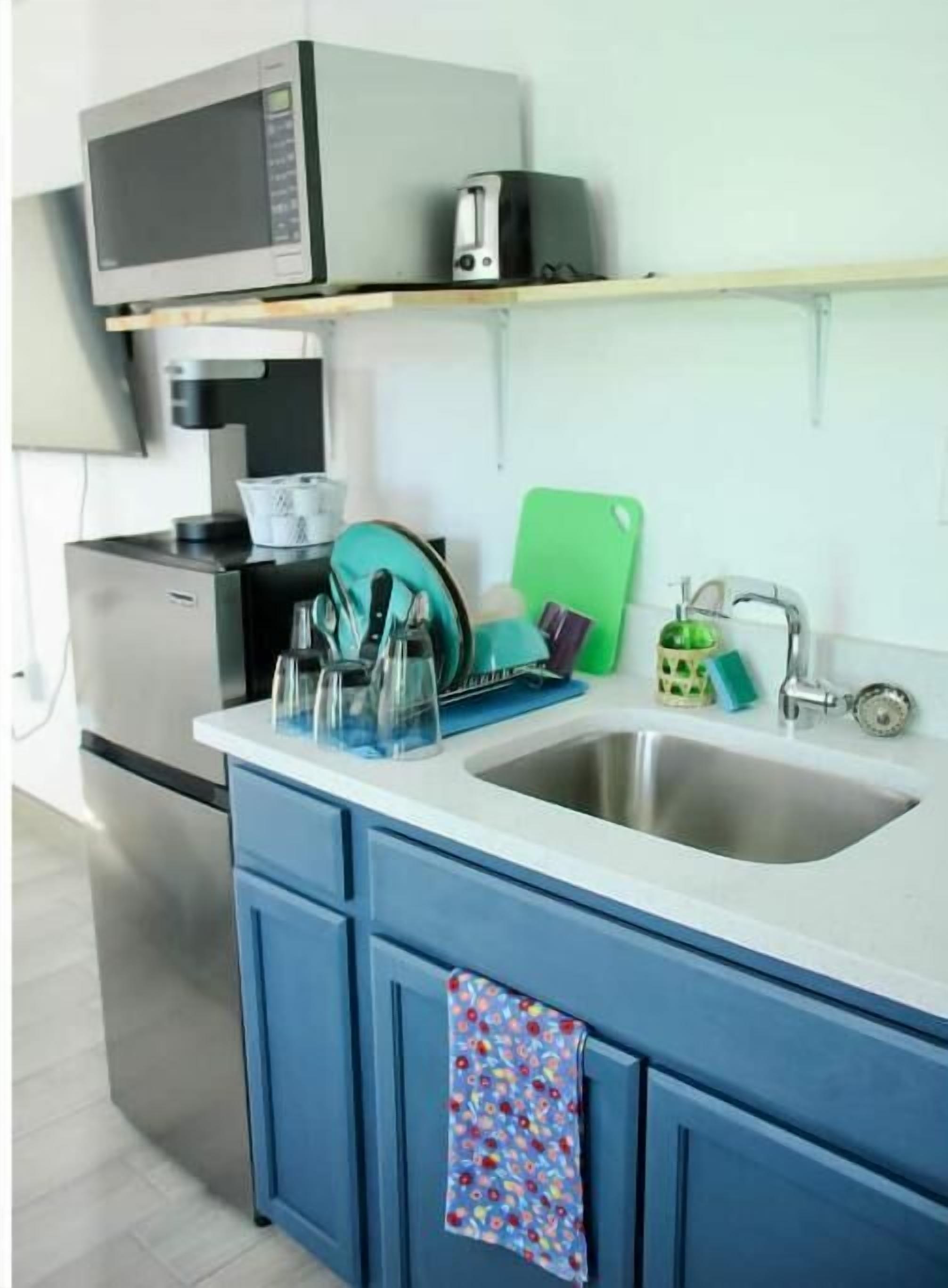 Fridge, microwave, stovetop, coffee/tea maker