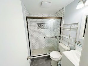 Shower, hair dryer, towels, soap