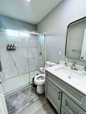Shower, hair dryer, towels, soap