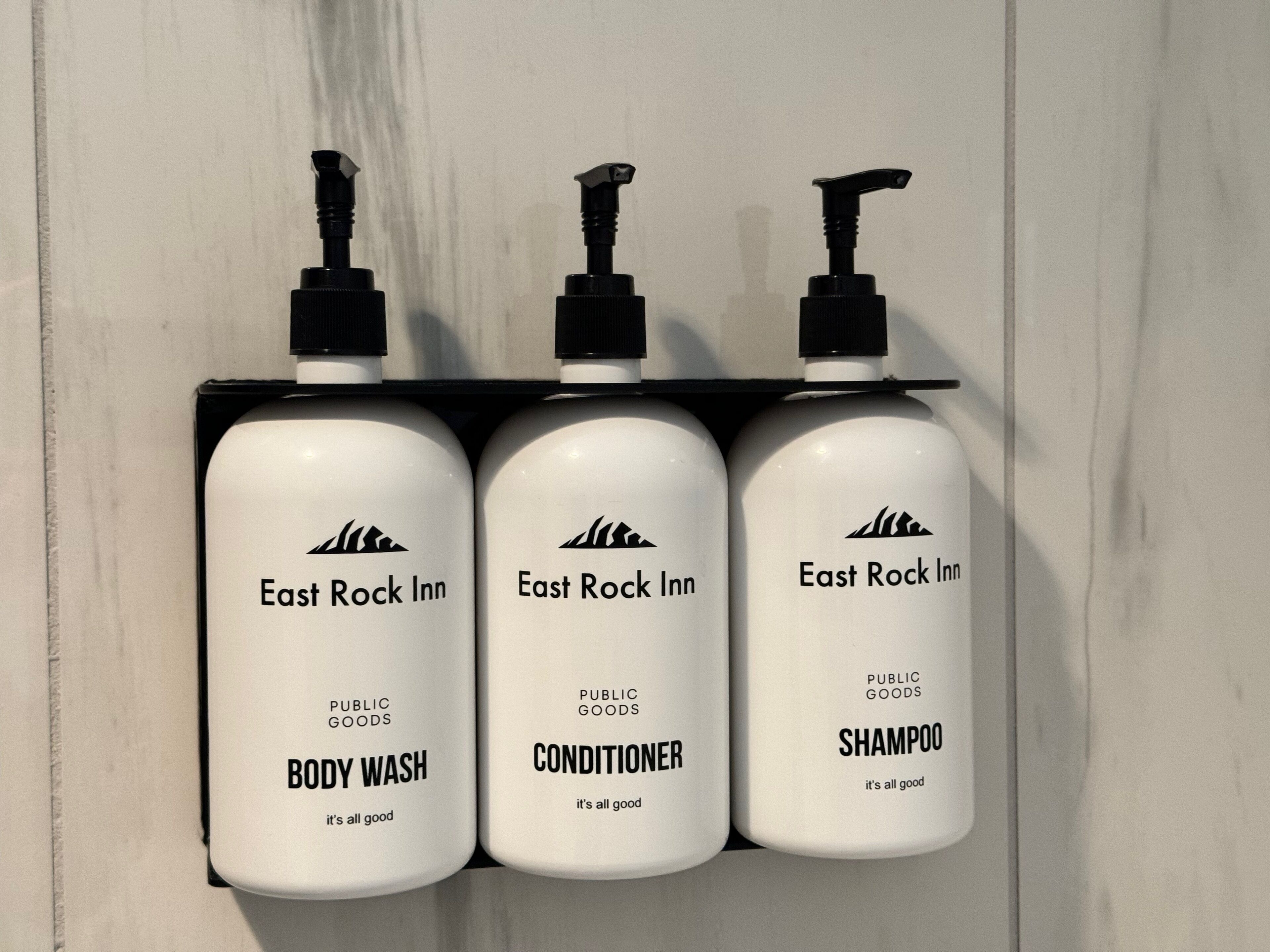 Three bottles of East Rock Inn public goods on a shelf.