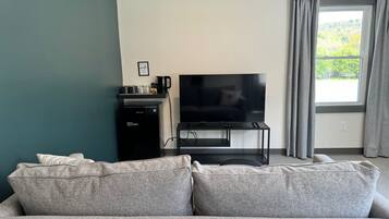Superior Suite, 1 Bedroom, Microwave, Courtyard View | Living area | 55-inch Smart TV with digital channels, Netflix, Hulu